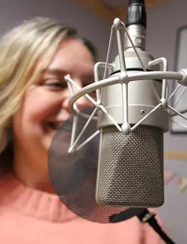 Natalie Cooper at the mic - she is out of focus behind an in-focus mic.